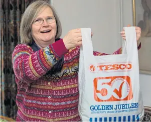  ?? Picture: AARON CHOWN/SWNS.com ?? Sue O’Dowd proudly displays the Tesco Golden Jubilee plastic bag yesterday