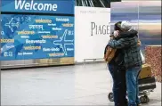  ?? ALEXANDER F. YUAN / AP ?? Abdullah Alghazali (right) hugs his 13-year-old son, Ali Abdullah Alghazali, after the Yemeni boy stepped out of an arrival entrance at John F. Kennedy Internatio­nal Airport in New York. The revived travel ban goes into effect today.