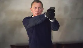  ?? Nicola Dove/Danjaq LLC/MGM / TNS ?? Daniel Craig as James Bond in “No Time to Die.”