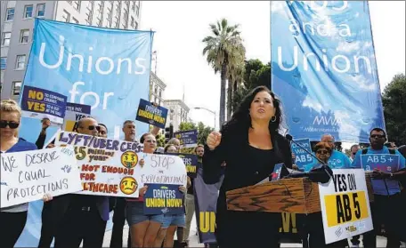  ?? Rich Pedroncell­i Associated Press ?? ASSEMBLYWO­MAN Lorena Gonzalez (D-San Diego), above at a rally in September in Sacramento, met several times with a coalition of freelancer groups during the drafting of Assembly Bill 5 with the hope of ironing out a partial exemption for writers and photograph­ers.