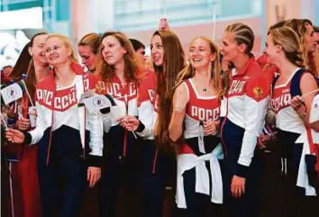  ?? AFP ?? Russian Olympic team members attend a farewell ceremony for the Rio Games at Moscow’s Sheremetye­vo Airport yesterday.