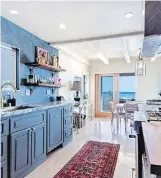  ??  ?? Top: A room in Leonardo DiCaprio’s Carbon Beach home opens onto a beach-facing deck. Above: Among the 1,765 square feet of living space is a galley-style kitchen.