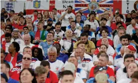  ?? Photograph: Tom Jenkins/The Observer ?? England fans take in the 3-0 defeat of Wales at the Ahmad bin Ali Stadium.