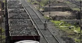  ?? Bloomberg ?? A freight train laden with coal in Paradeep, Odisha, India. Coal consumptio­n is cheaper than wind or solar, making it an appealing choice in India and other nations seeking cheap electricit­y.
