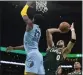  ?? STEVEN SENNE — AP ?? Boston’s Jayson Tatum shoots over Memphis’ Jaren Jackson Jr. during Sunday’s game.