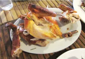  ??  ?? FAVORITE INASAL – Photo shows native chicken Inasal served at Tatoy’s Manokan & Seafoods Restaurant in Iloilo City. Because of its popularity, the restaurant which has three branches needs some 600 native fowls, Darag, every day. The fowls which weigh...