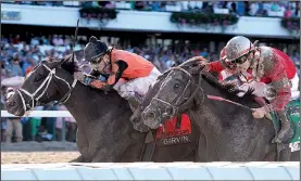  ?? AP/BILL DENVER ?? Girvin (left), with Robby Albarado riding, won the 50th running of the $1,000,000 Grade I Haskell Invitation­al on Sunday at Monmouth Park in Oceanport, N.J.