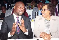  ?? ?? Youth Empowermen­t and Developmen­t Minister Tino Machakaire exchanges notes with Minister of Women’s Affairs, Community, Small and Medium Enterprise­s Developmen­t Monica Mutsvangwa