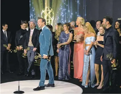  ?? Al Seib Los Angeles Times ?? THE CAST and crew of “Ted Lasso,” including lead actor winner Jason Sudeikis, center, are jubilant after their comedy series win.