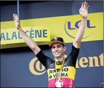  ??  ?? Belgium’s Wout Van Aert celebrates on the podium after winning the eleventh stage of the Tour de France cycling race over 198.9 kilometers (123.6 miles) with start in Sorgues and finish in Malaucene, France, on July 7. (AP)