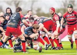  ??  ?? Dings No8 Jake Holcombe crashing over for at try against Old Reds