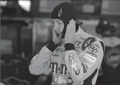  ?? The Associated Press ?? PRACTICE RUN: Kyle Busch waits in his car before practice for Sunday’s Coca-Cola 600 at Charlotte Motor Speedway in Concord, N.C., where he won the All-Star race last weekend.