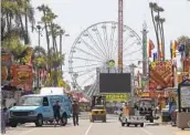  ?? U-T- FILE ?? Workers prepare to open the San Diego County Fair in Del Mar in 2019, the last year it was open.