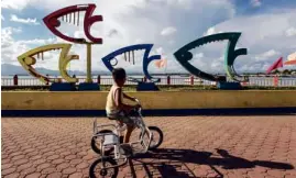  ?? SABANGAN II —LEO ?? A boy enjoys a bike ride at Puerto Princesa City’s baywalk.