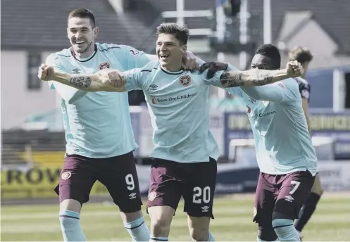  ??  ?? 0 Ross Callachan, centre, celebrates his goal against Dundee. It was his fourth for Hearts since moving from Raith Rovers in August.