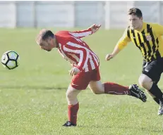  ??  ?? Millfield Free Gardeners (yellow and black) take on Myers last weekend.