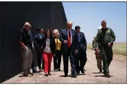  ?? (AP/Evan Vucci) ?? U.S. Border Patrol chief Rodney Scott (right) gives President Donald Trump a tour of a section of the border wall Tuesday in San Luis, Ariz.