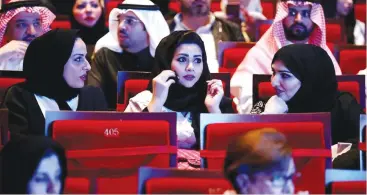  ??  ?? Saudis are rejoicing the government’s decision to allowing opening cinemas across the Kingdom. Earlier this year, musical concerts were allowed in the Kingdom to boost entertainm­ent activities. In this file photo dated Dec. 3, Saudis watch composer...