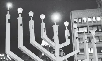  ?? KENNETH K. LAM TNS ?? Baltimore's Jewish community has one of the largest outdoor menorahs.