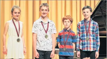  ?? SUBMITED ?? Four of Lorri Dunn’s School of Music students picked up provincial medals this year. They include: Faith Benjamin, left, Evan Moser, Liam Edelstein and Alec Corbett.