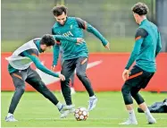  ?? — AP ?? Liverpool’s Luis Diaz (left) and Mohamed Salah at a training session ahead of their Champions League final.