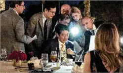  ?? SHANNON DONNELLY / PALM BEACH DAILY NEWS ?? Aides surround Japanese Prime Minister Shinzo Abe (seated, facing camera) at Mar-a-Lago after he and President Donald Trump (right, blocked from view) hear of a North Korean missile launch Feb. 11.