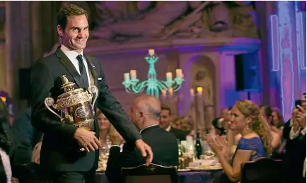  ??  ?? Eight-time winner Roger Federer attends the Wimbledon champions’ dinner at The Guildhall in London this week.