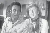  ?? WARNER BROS. ?? In the 1974 Mel Brooks comedy Blazing Saddles, Wilder famously teamed with Cleavon Little in the groundbrea­king Western spoof.