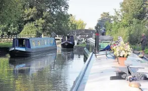  ?? ?? Waiting for two boats to exit a lock one at a time on the K&A. Brian Butterfiel­d on Majii Mtoto to my front, as we linger at the temporary lock mooring before entering, one at a time.