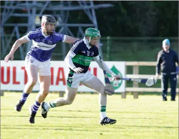  ??  ?? John Gaughan hinders the progress of Bray captain Christy Moorehouse.