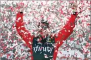  ?? CHET STRANGE — THE ASSOCIATED PRESS ?? Carl Edwards celebrates after winning the Sprint Cup auto race at Richmond Internatio­nal Raceway in Richmond, Va., Sunday.