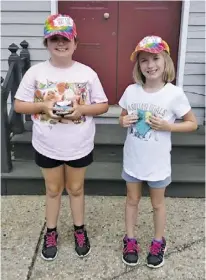  ?? BY LINDA BALDWIN ?? Sara and Lily Baldwin, painted rocks and hid them through the town of Little Washington. They are the daughters of Richie and Linda Baldwin of Sperryvill­e.