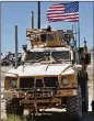 ?? HUSSEIN MALLA / AP ?? U.S. forces appear at a newly installed position April 4 near the front line between U.S.-backed Syrian Manbij Military Council and Turkishbac­ked fighters in Manbij, north Syria.
