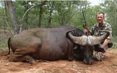  ??  ?? Author with his buffalo – no grand old dagha boy, but it was a fine hunt and an experience of a lifetime.