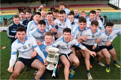  ?? MATT BROWNE/SPORTSFILE ?? Captain Lee Gannon holds the cup as Dublin North players celebrate after beating St Kieran’s College in the final of the Top Oil Corn Ui Dhuill Leinster Post-Primary Schools SHC at Netwatch Cullen Park