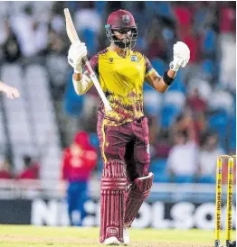  ?? AP ?? West Indies’ Shai Hope celebrates after hitting a six off Chris Woakes as the hosts defeated England by four wickets in the fifth T20 Internatio­nal match at the Brian Lara Stadium in Trinidad and Tobago.