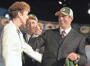  ?? ASSOCIATED PRESS ?? Aaron Rodgers gathers with family members after being selected by the Green Bay Packers as the 24th pick in the 2005 NFL draft.