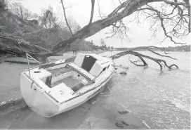  ??  ?? A derelict boat is seen on the beach in Cadboro Bay in February. At the Union of B.C. Municipali­ties annual convention this month, Oak Bay, Victoria and Ladysmith will call for a national strategy for dealing with abandoned vessels.