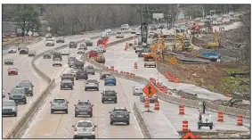  ?? Arkansas Democrat-Gazette/THOMAS METTHE ?? Traffic flows along Interstate 630 on Friday as constructi­on crews work on the widening project. A lawsuit filed in Pulaski County Circuit Court is challengin­g how the state is funding the project.