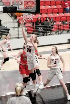  ?? Photograph by Russ Wilson ?? With six seconds left, senior Lady Blackhawk Blakelee Winn scored the final point of the game in a 51-46 conquest of rival Farmington. She led all scorers with 30 points.