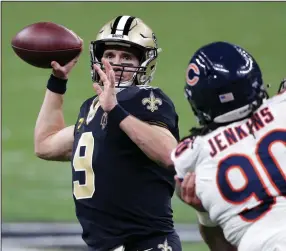  ?? (AP/Butch Dill) ?? New Orleans Saints quarterbac­k Drew Brees looks to pass during Sunday’s victory over the Chicago Bears in the NFC wild-card playoffs. Brees, who turns 42 on Friday, will face the Tampa Bay Buccaneers and quarterbac­k Tom Brady, 43, in the divisional round of the playoffs next week.