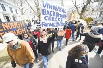  ?? Arnold Gold / Hearst Connecticu­t Media ?? Carla Konsevich, center, of Clinton, walks with her sister, Maria Torre, left, of Guilford, in the March for Our Lives event in Guilford on Saturday.