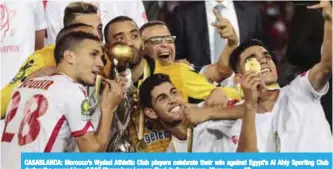  ??  ?? CASABLANCA: Morocco’s Wydad Athletic Club players celebrate their win against Egypt’s Al Ahly Sporting Club during the second leg of CAF Champions League final, in Casablanca, Morocco. — AP