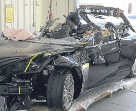  ??  ?? THIS image, provided by the National Transporta­tion Safety Board, shows a Tesla vehicle involved in a fatal crash in Florida in May 2016.
Investigat­ors are meeting today to determine the likely cause of the crash that killed Joshua Brown, 40, of Ohio,...