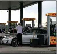  ?? (Arkansas Democrat-Gazette/Thomas Metthe) ?? Motorists gas up Friday at a Love’s truck stop on Interstate 30 in south Little Rock as Memorial Day weekend begins.