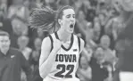  ?? JEFFREY BECKER/USA TODAY SPORTS ?? Iowa guard Caitlin Clark reacts after breaking the Division I scoring record Sunday against Ohio State.