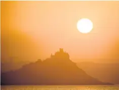  ?? ?? Sunrise over St Michael’s Mount, which lies just off the coast of Marazion in Cornwall