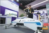  ?? NI YANQIANG / FOR CHINA DAILY ?? A device designed to scan subway trains as they enter tunnels is displayed on Sunday during an exhibition at the United Nations World Geospatial Informatio­n Congress in Deqing, Zhejiang province.