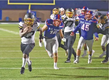  ?? STAFF PHOTOS BY MATT HAMILTON ?? McMinn County running back Jalen Hunt bursts through Cleveland’s defense on his way to the end zone for a touchdown during the visiting Cherokees’ 42-7 win Friday night. The Cherokees, ranked fourth in Class 6A, improved to 8-0 overall and 4-0 in Region 2.