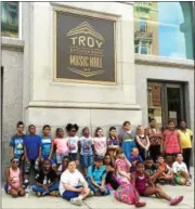  ??  ?? Third-graders in the Troy City School District’s Elementary Summer Academy program pose in front of the Troy Savings Bank Music Hall in downtown Troy on Monday during a walking tour of the area’s historic buildings.